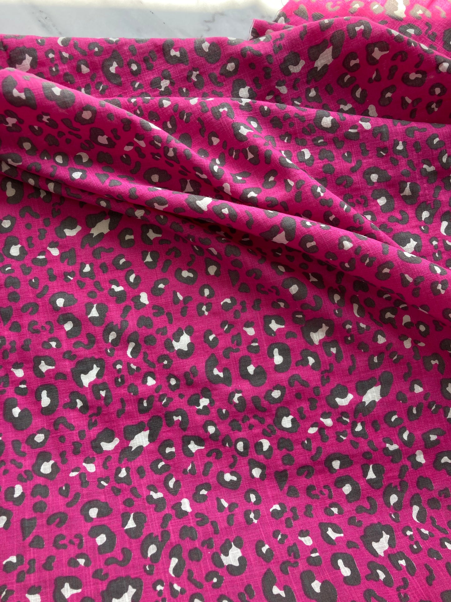 Linen look cerise pink leopard print fabric