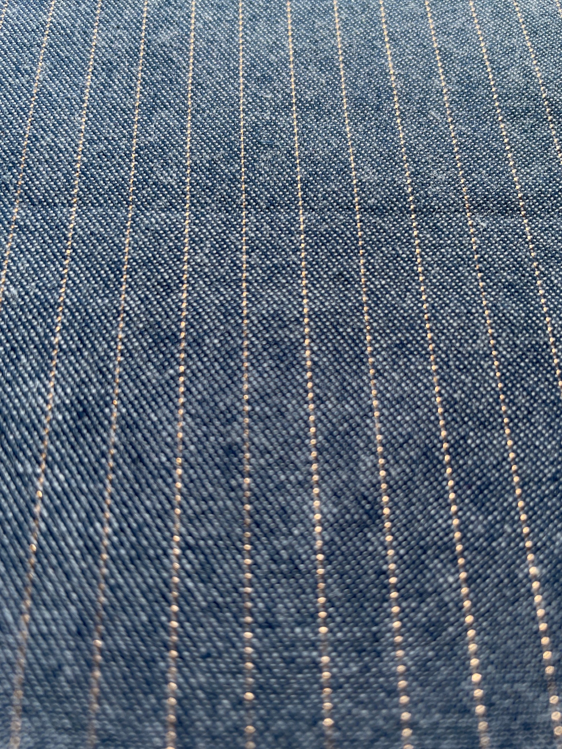 Blue denim fabric with a copper metallic horizontal stripe