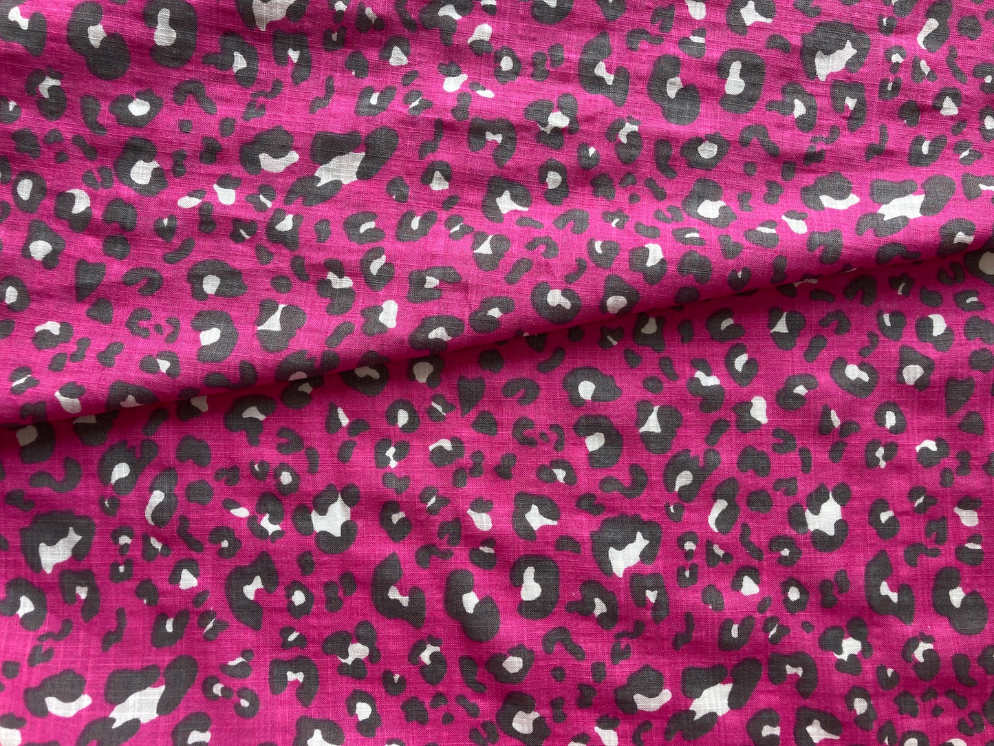 Linen look cerise pink leopard print fabric