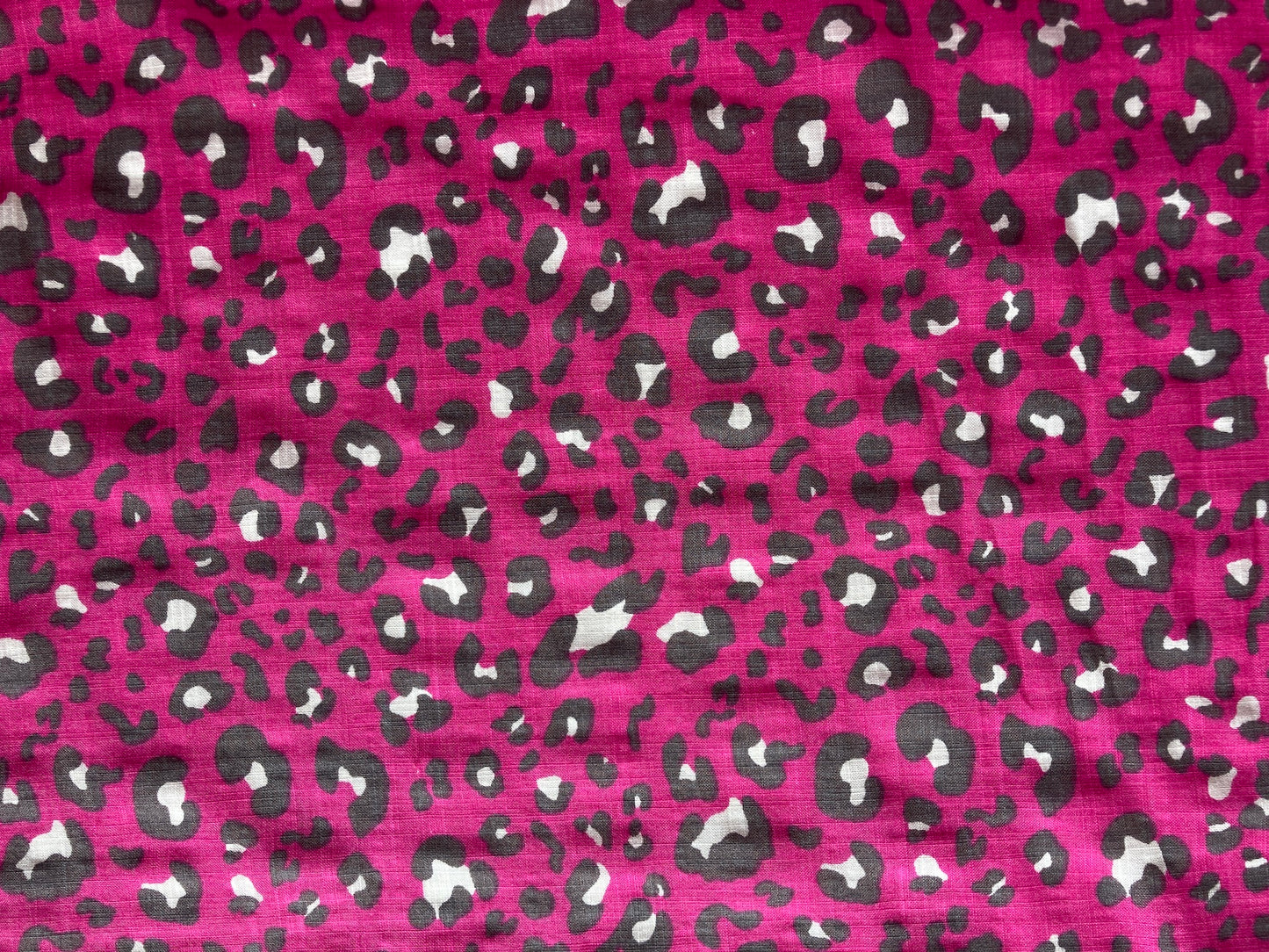 Linen look cerise pink leopard print fabric